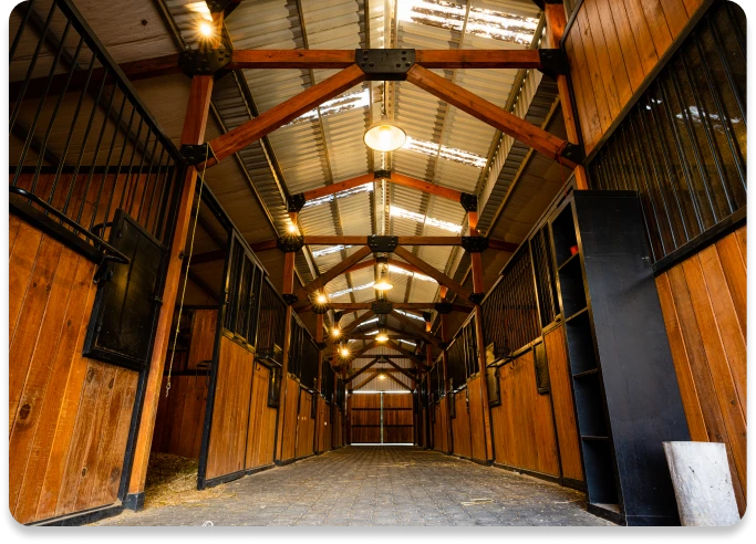 Wooden stable interior with metal accents.